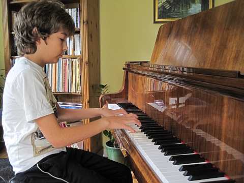Image of Paul practising piano in Pinner
